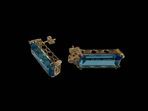 Pair of topaz and diamond drop earrings set in 9 carat yellow gold.