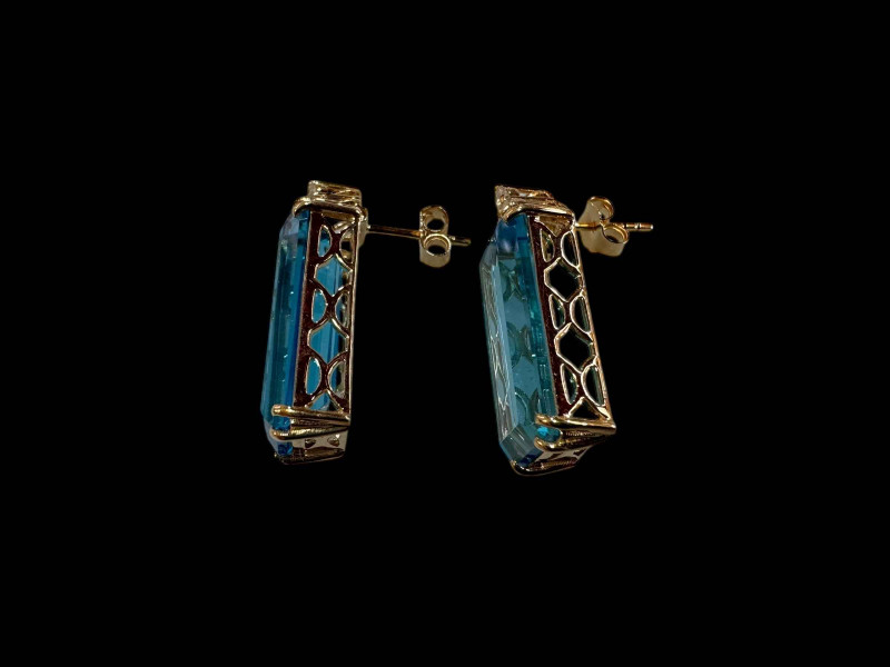 Pair of topaz and diamond drop earrings set in 9 carat yellow gold.
