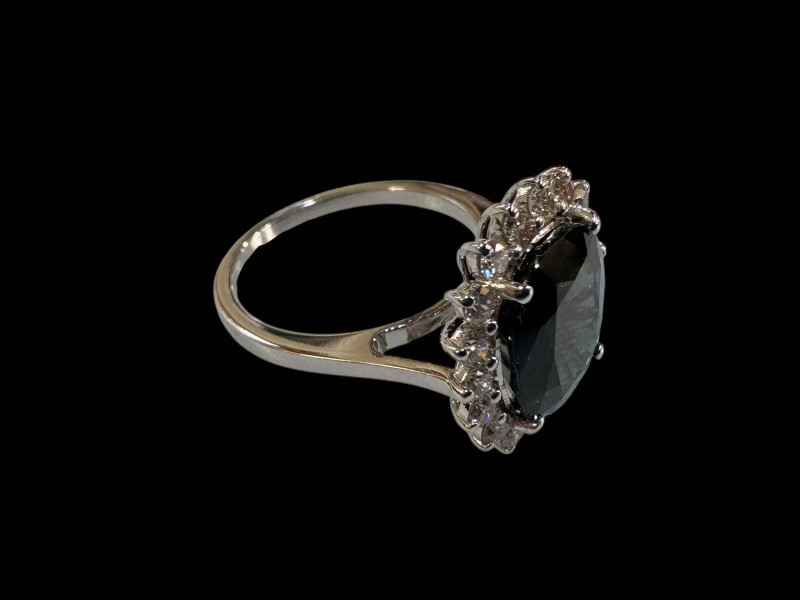 18 carat white gold, sapphire and diamond cluster ring with sapphires totalling over 5.5 carats.