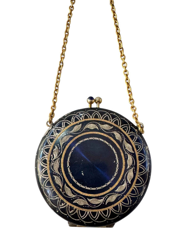 Gilt metal and enamel decorated sovereign case in the form of a ladies compact.