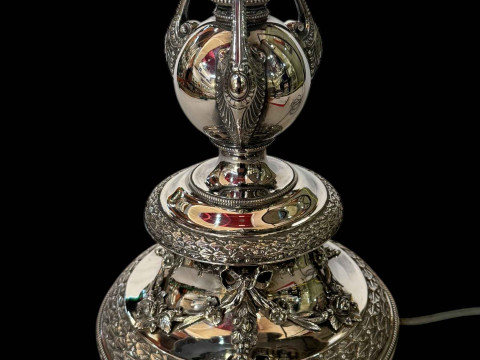 Victorian silver oil lamp converted to electric, the column having ancanthus decoration and detachable swags and on scroll form feet, hallmarked to base rim and reservoir holder, maker HW, Birmingham 1873, height to reservoir holder 47cm. thumbnail