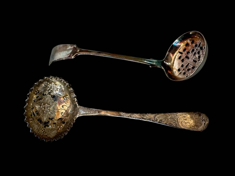 Early 19th Century silver sifting spoon with chased decoration and silver plated sifter (2).