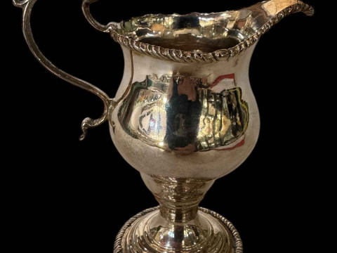 George III silver helmet cream jug having gadroon borders, London 1767,...