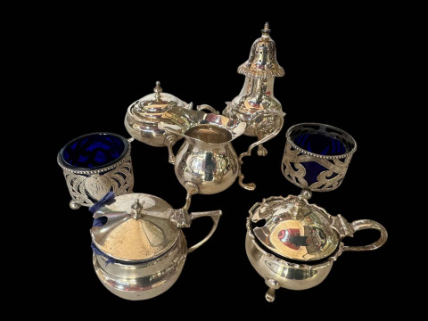 Collection of six silver cruets and small jug including pair of pierced...