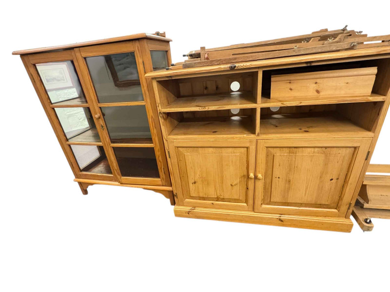 Pine glazed two door bookcase and pine two door entertainment cabinet (2).