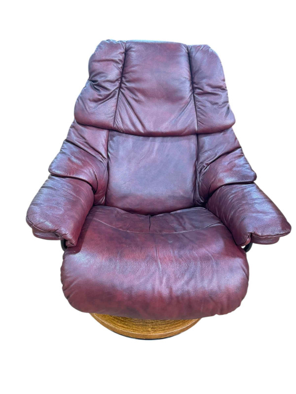 Stressless burgundy leather adjustable reclining armchair.