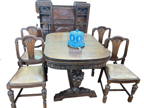 1930's carved oak Lees style six piece dining suite comprising bureau...