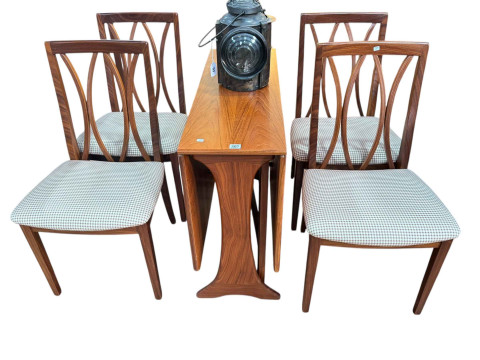 G Plan teak drop leaf dining table and four chairs.