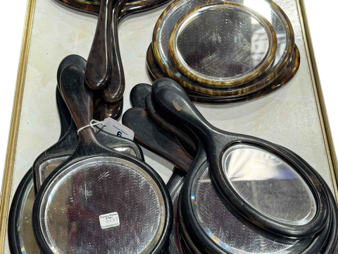 Collection of fifteen 1920's boudoir mirrors in ebony and tortoiseshell...