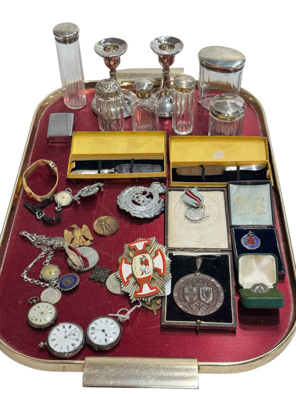 Tray lot with six silver topped jars, pair silver candlesticks, watches, medals, badges, etc.