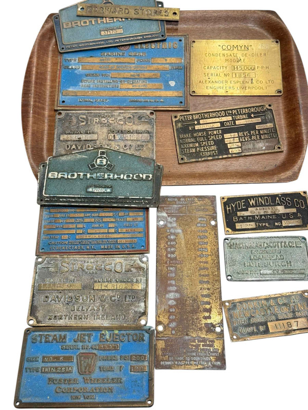 Collection of vintage machine brass plates.