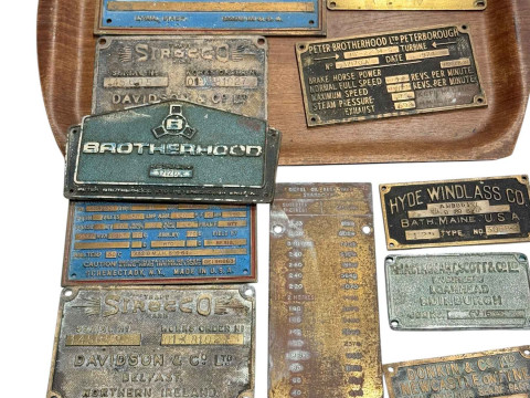 Collection of vintage machine brass plates.