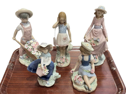 Five Lladro figures including Flowers in the Basket and Wheelbarrow with...