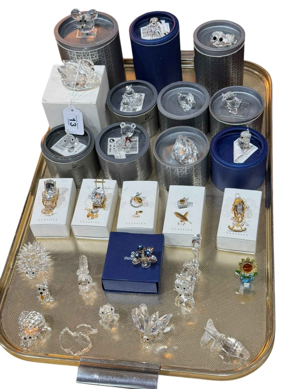 Tray lot of twenty seven Swarovski pieces including boxed items and classics.