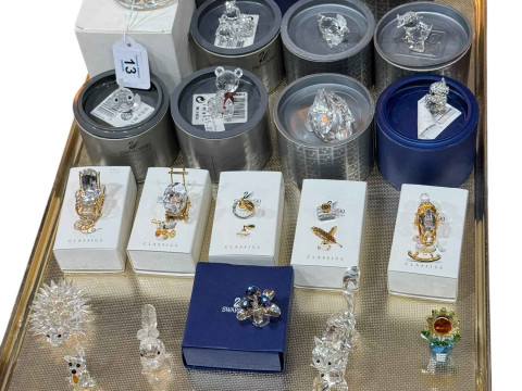 Tray lot of twenty seven Swarovski pieces including boxed items and classics.