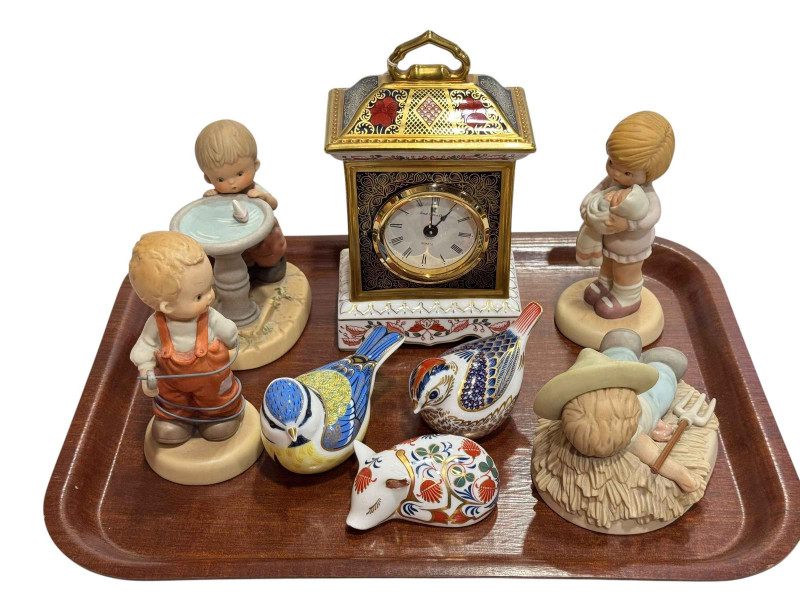 Royal Crown Derby Imari mantel clock, three paperweights, and four Lucie Attwell figures (8).