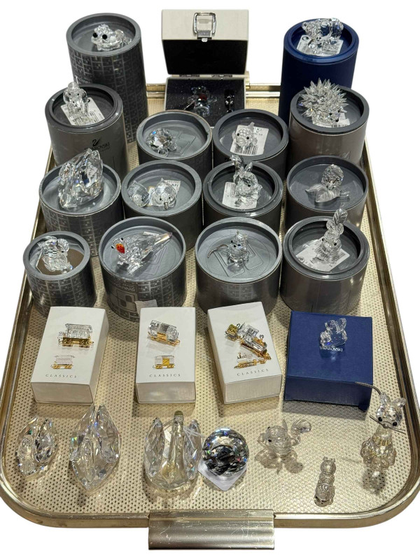 Tray lot of twenty six Swarovski pieces including boxed items and classics.