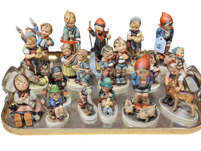 Seventeen Hummel child figures.