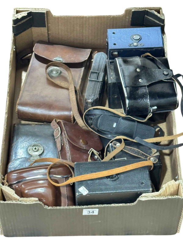 Box of vintage cameras.