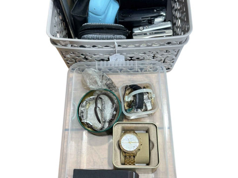 Two boxes with watches, cameras and photograph frames.