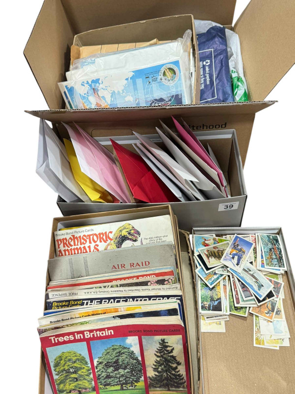 Box of stamps, first day covers and world stamps, and collection of cigarette cards.