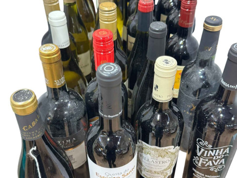 Twenty six bottles of red and white wine.