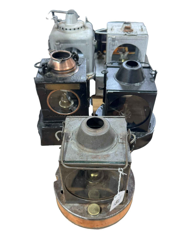 Five vintage railway lamps.