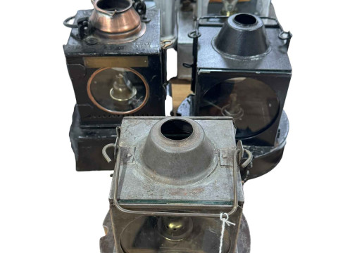 Five vintage railway lamps.