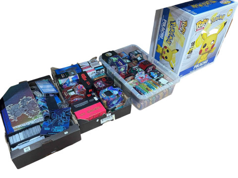Three boxes of Pokemon cards, many tinned sets, and boxed Pikachu vinyl...