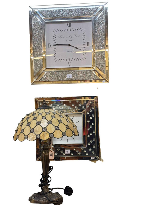 Two contemporary mirror panelled quartz wall clocks and table lamp (3).
