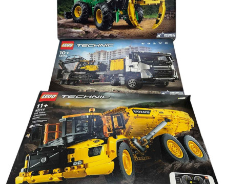 Five boxed Lego Technic construction and farm vehicle construction kits,...