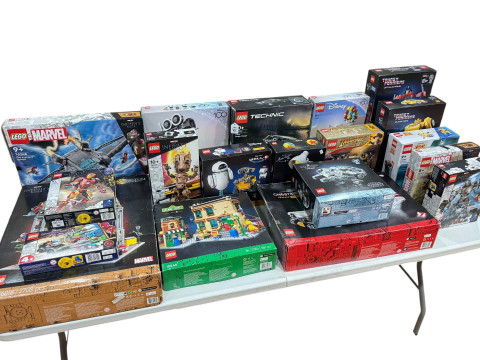Nineteen boxed Lego Marvel, Disney, Film & TV Themed construction kits,...