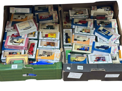 Two boxes of Days Gone and other boxed model vehicles.