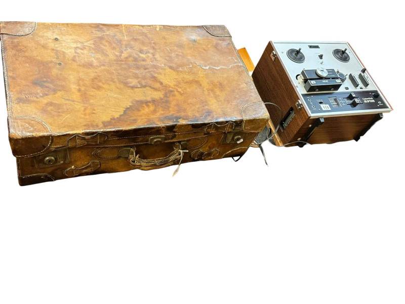 Vintage Akai X2000 tape deck and vintage leather suitcase.