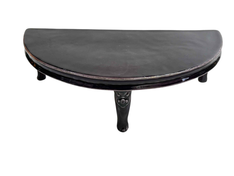 Chinese porcelain demi lune stand raised on three face mask and paw feet, 26cm by 14cm.