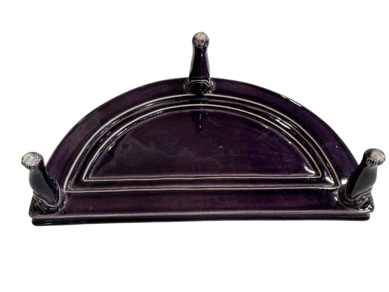 Chinese porcelain demi lune stand raised on three face mask and paw feet, 26cm by 14cm.