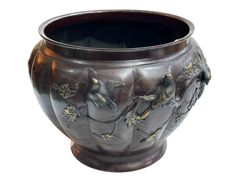 Large Japanese bronze jardiniere decorated with raised bird and foliage, 28cm high by 40cm deep.