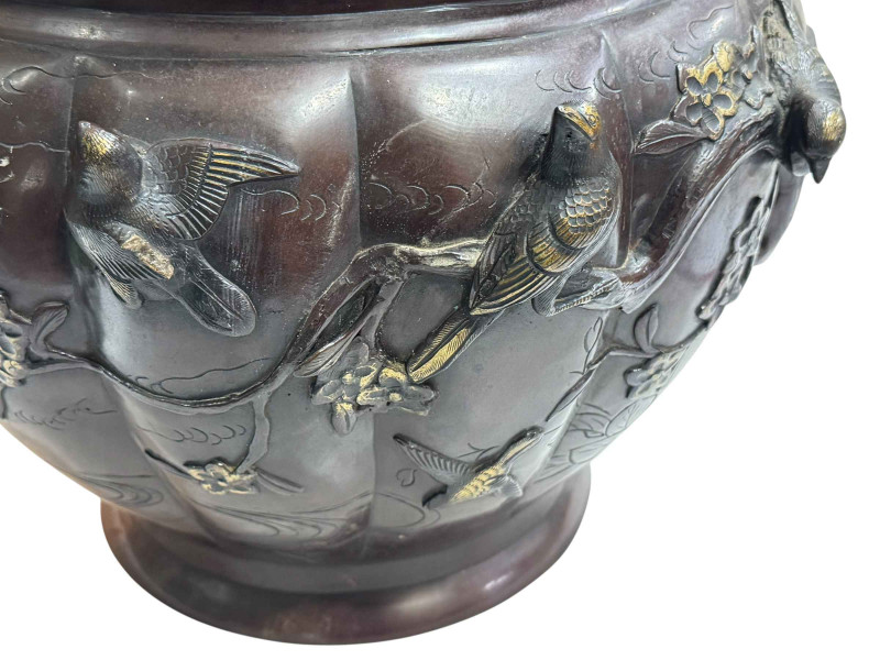 Large Japanese bronze jardiniere decorated with raised bird and foliage, 28cm high by 40cm deep.