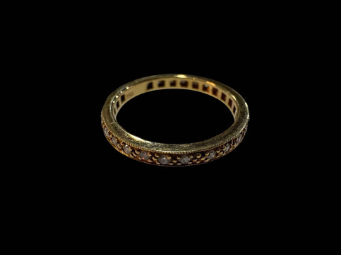 18 carat yellow gold and diamond full eternity ring, size M.