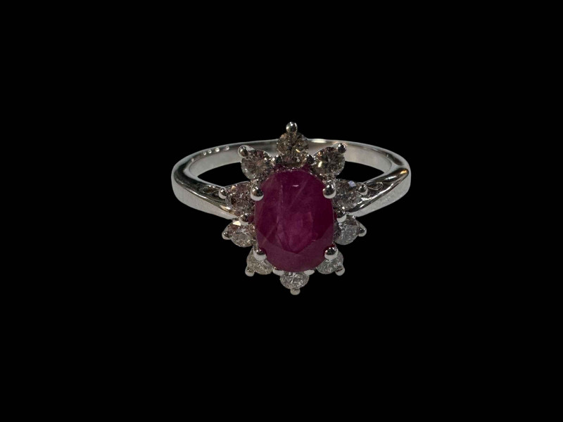 18 carat white gold oval ruby and diamond cluster ring, size M.