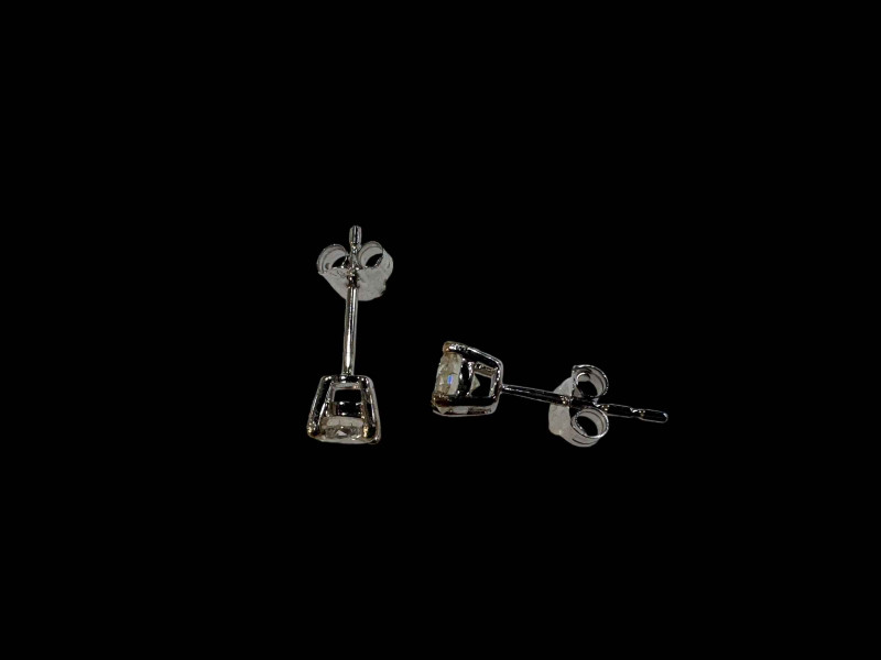 Pair of 18 carat white gold and diamond stud earrings, diamonds over 0.50 carats.