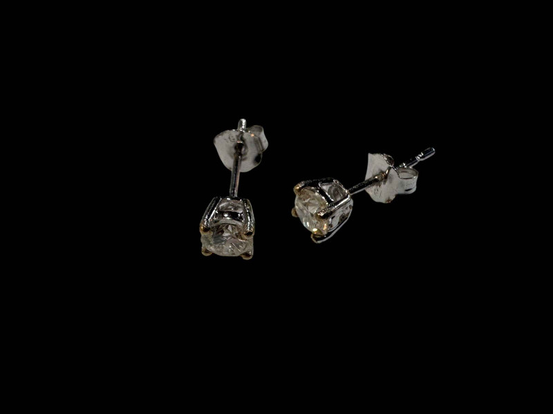 Pair of 18 carat white gold and diamond stud earrings, diamonds over 0.50 carats.