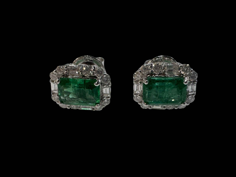 Pair of emerald and diamond cluster earrings set in 18 carat white gold.