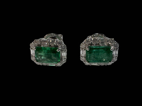 Pair of emerald and diamond cluster earrings set in 18 carat white gold.