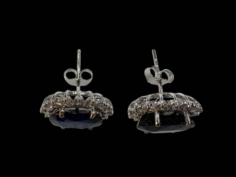 Impressive pair of sapphire and diamond cluster earrings set in 18 carat whit gold, sapphires over 7 carats and over 1 carat of diamonds.