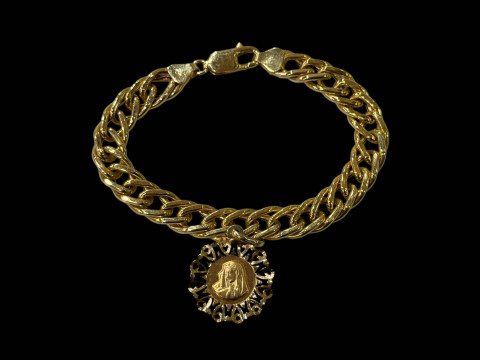 9 carat gold chain link bracelet with Mary medallion.