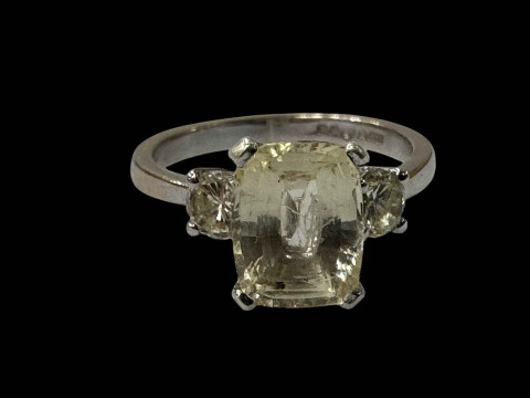 Sapphire and diamond 18 carat white gold ring, having cushion light yellow...