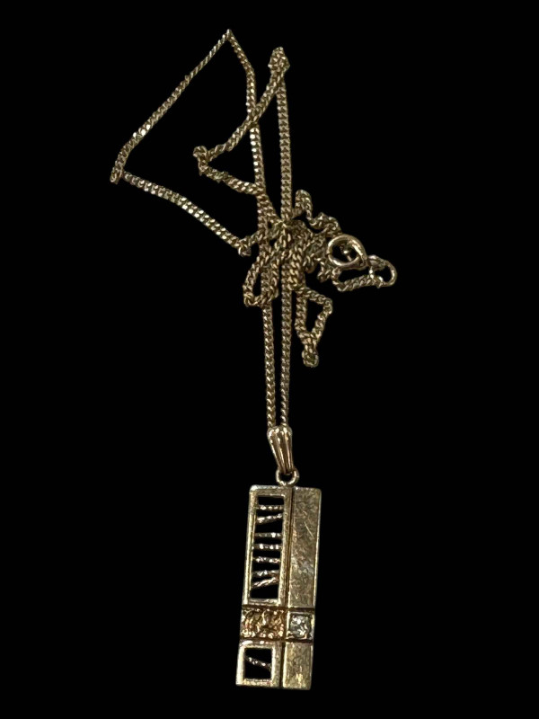 Diamond set 9 carat gold pendant with chain.