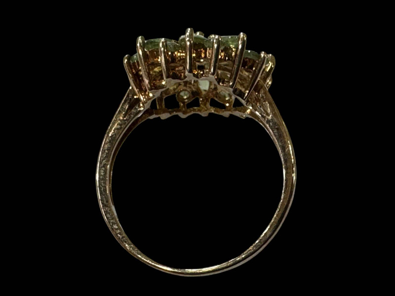 Peridot flower cluster 9 carat gold ring, size N/O.