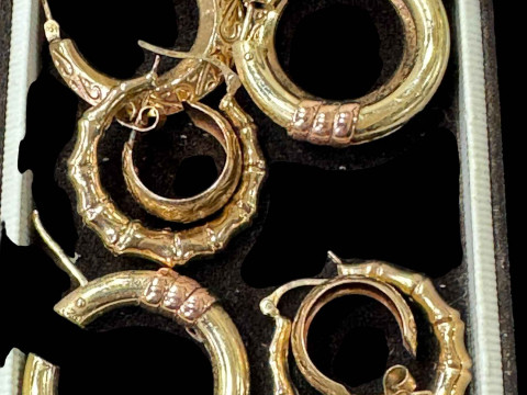 Four pairs of 9 carat gold earrings.